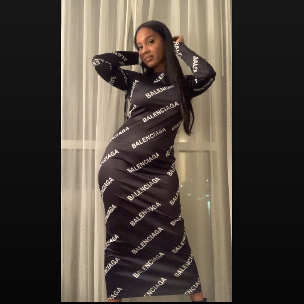 Large Monogrammed long sleeve stretchy evening dress.